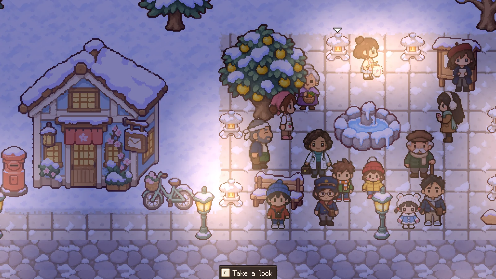 A snowy square at night lit by lanterns, the town gathered round a fountain